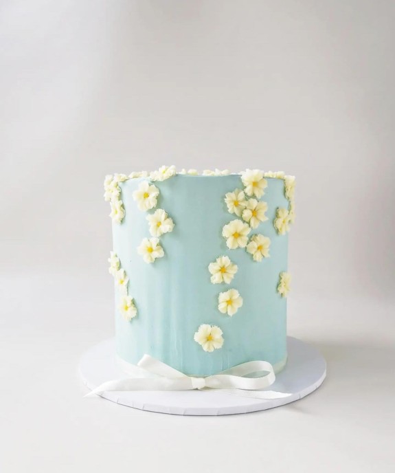 40 Best Birthday Cake Ideas 2022 — Soft Blue Cake Adorned with Daisy Buttercream